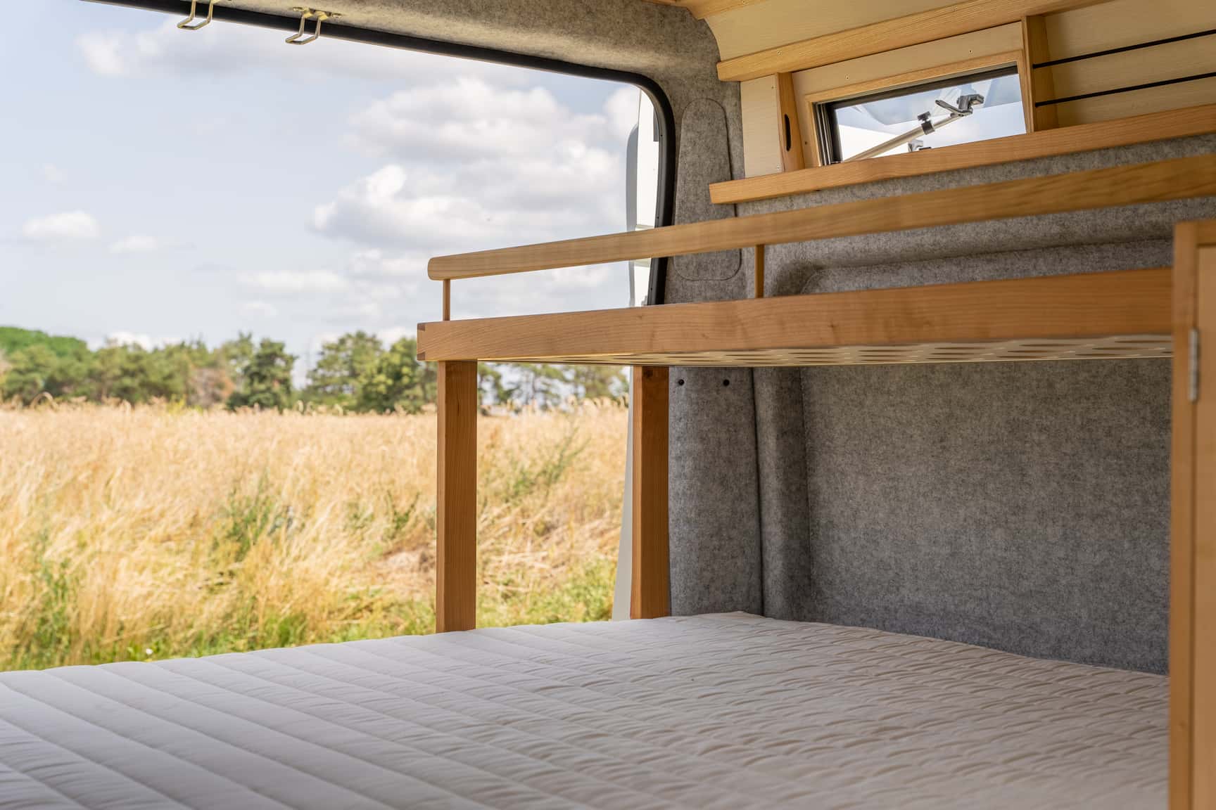 Bunk bed in the Peugeot Boxer camper made of cherry wood