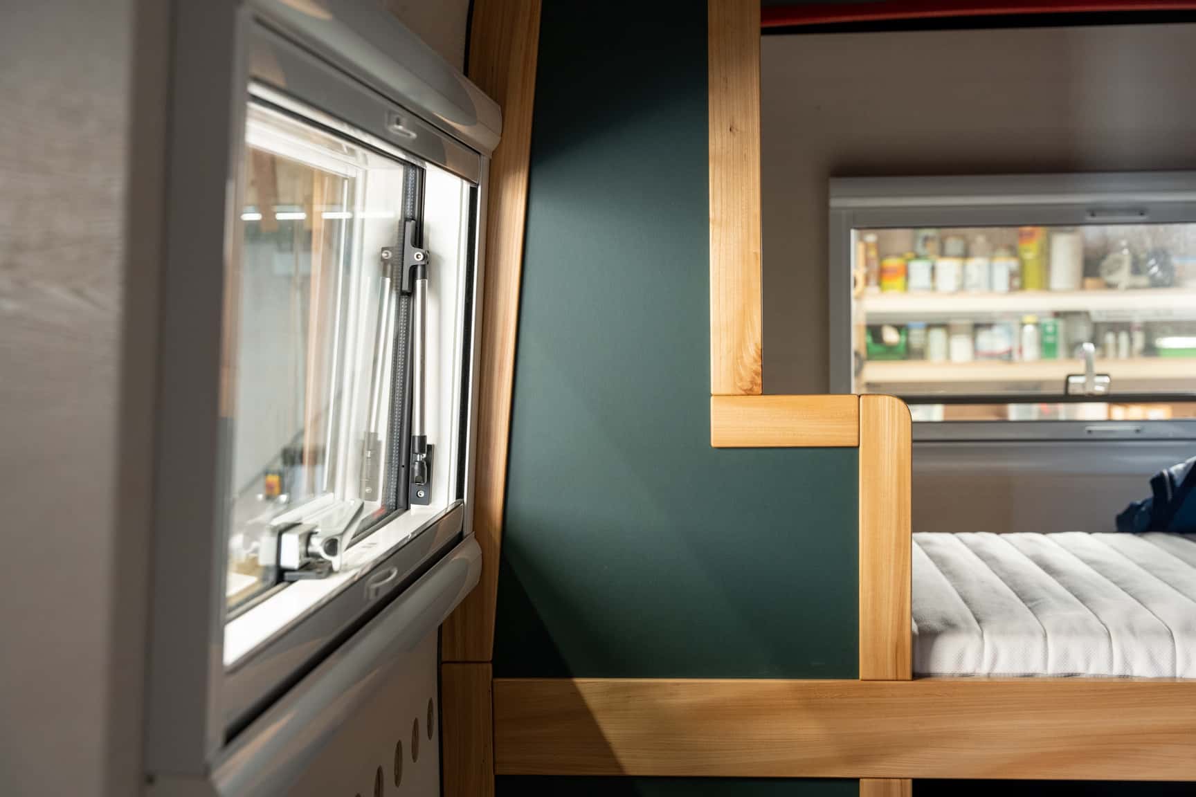 Divider between sleeping and living area in the Mercedes fire truck camper
