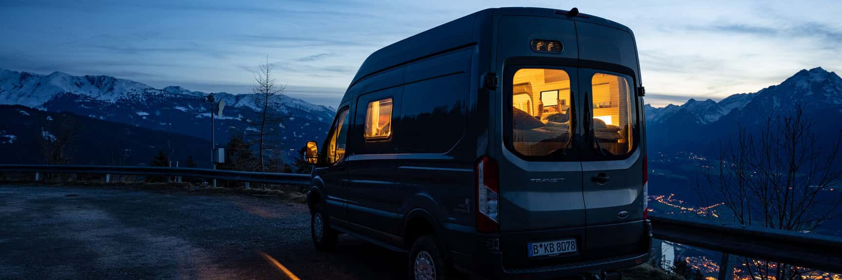Blue hour with the Ford Transit 4x4 camper above the Inn valley