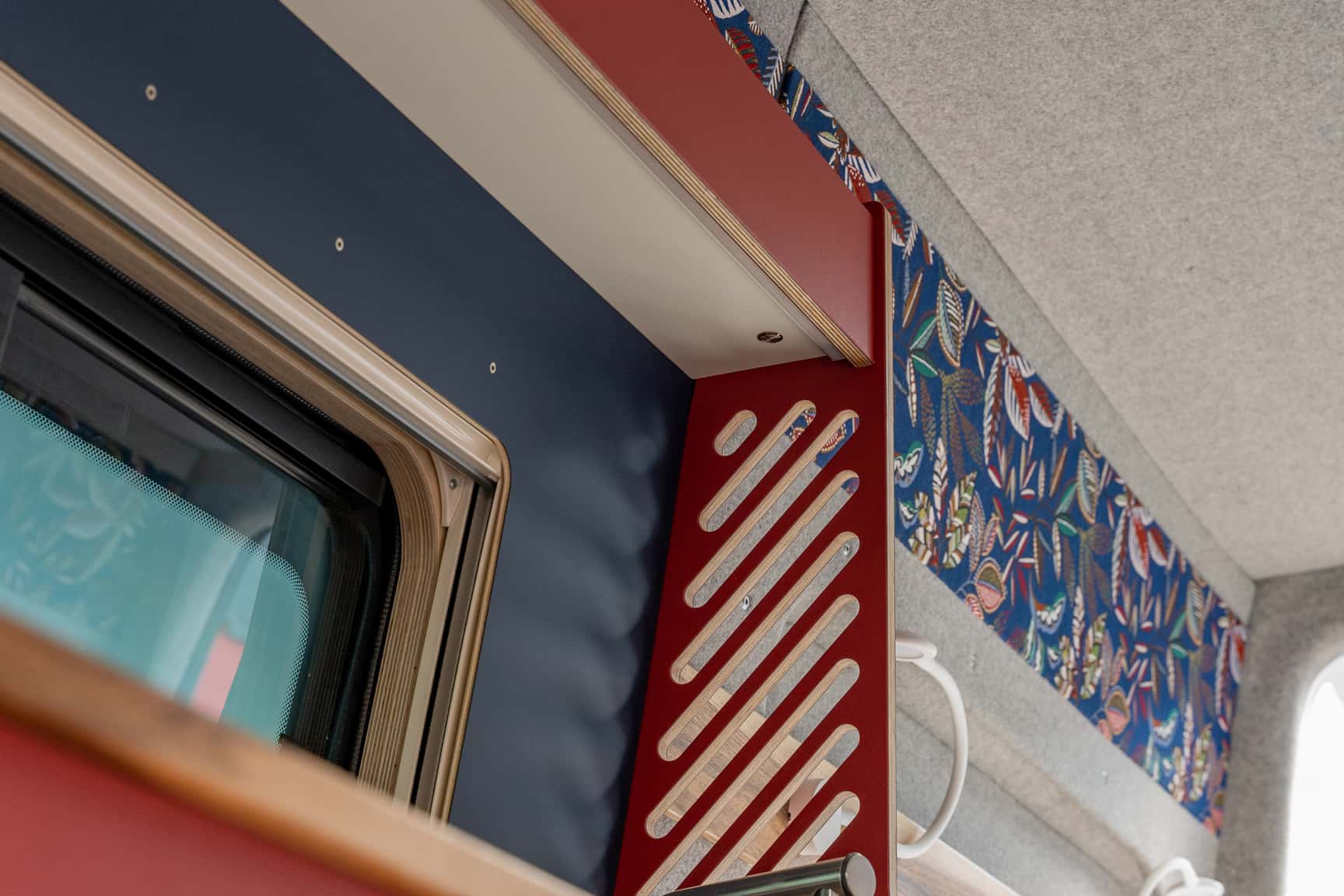Material mix of light wool felt, colorful fabric, red furniture linoleum, and blue Fenix laminate