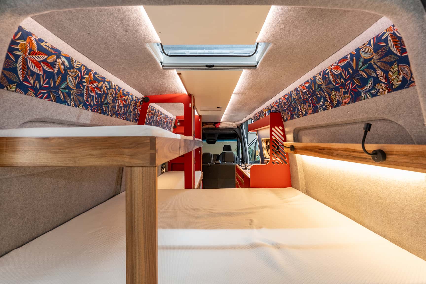 View into the Sprinter L3H2 conversion from the rear with rear storage